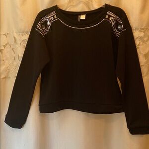 Black Top embellished with silver jewels and embroidery.
